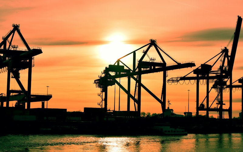Double-girder gantry crane spanning a shipyard dock