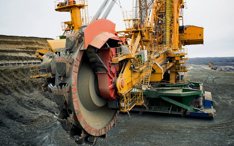 Heavy-duty yellow lifting equipment on an open industrial site